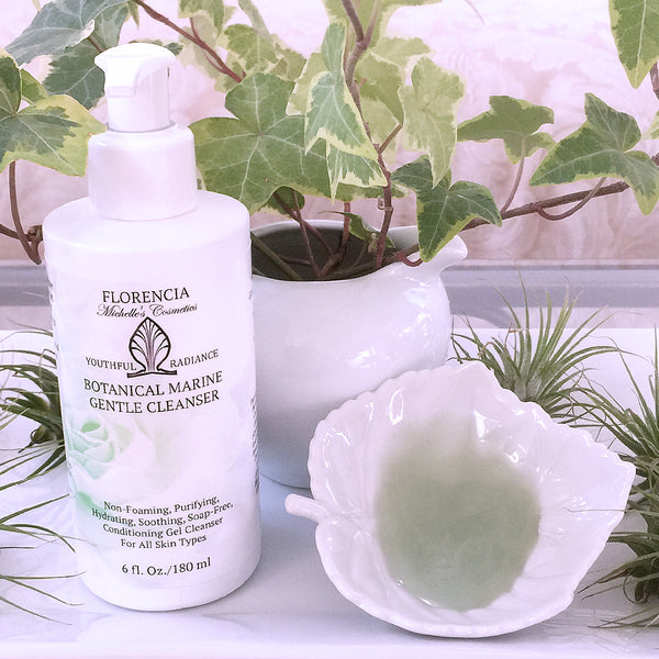 A Botanical Marine Gentle Cleanser bottle with cleanser in a small white leaf dish. 