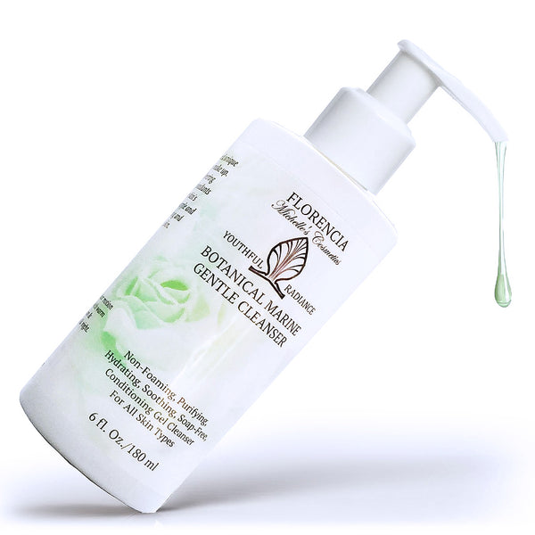 A bottle of Botanical Marine Gentle Cleanser tilted at a 45 degree angle with cleanser coming from the top