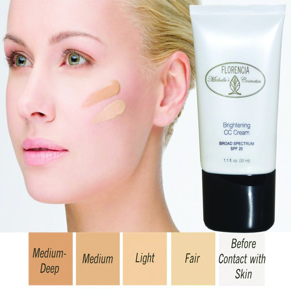 Woman with two shades of CC Cream Brightening SPF 20 on her cheek, a bottle of CC Cream Brightening SPF 20 and boxes with four shades from fair to medium-deep.
