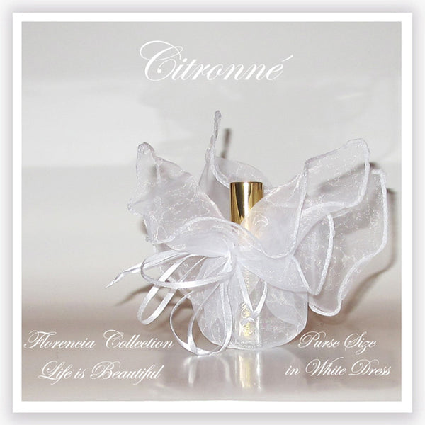 Bottle of perfume in a transparent white gift bag.