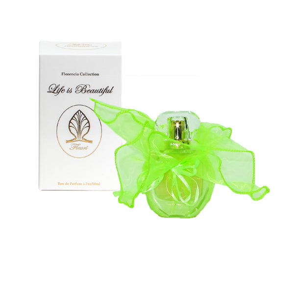 Fleuri Perfume bottle wrapped up in a transparent green gift bag in front a perfume box.