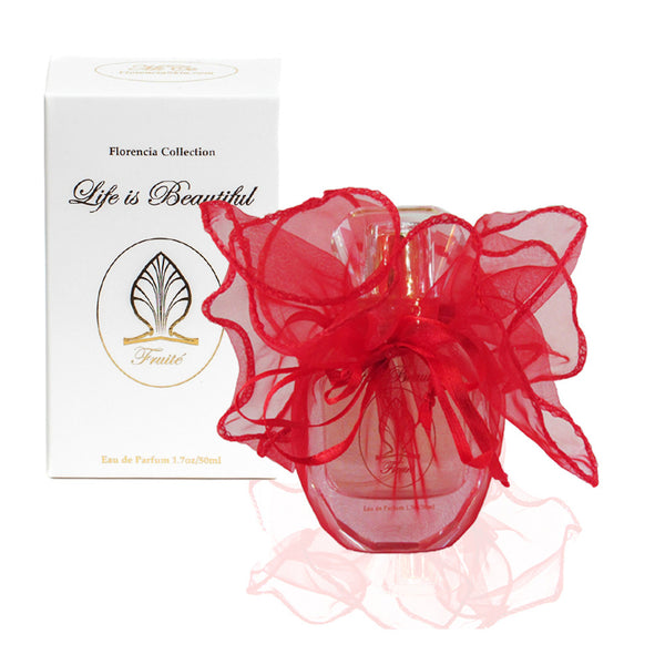Fruité Perfume bottle wrapped up in a transparent red gift bag in front a perfume box.