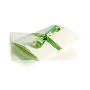 Gift certificated folded with a green ribbon.